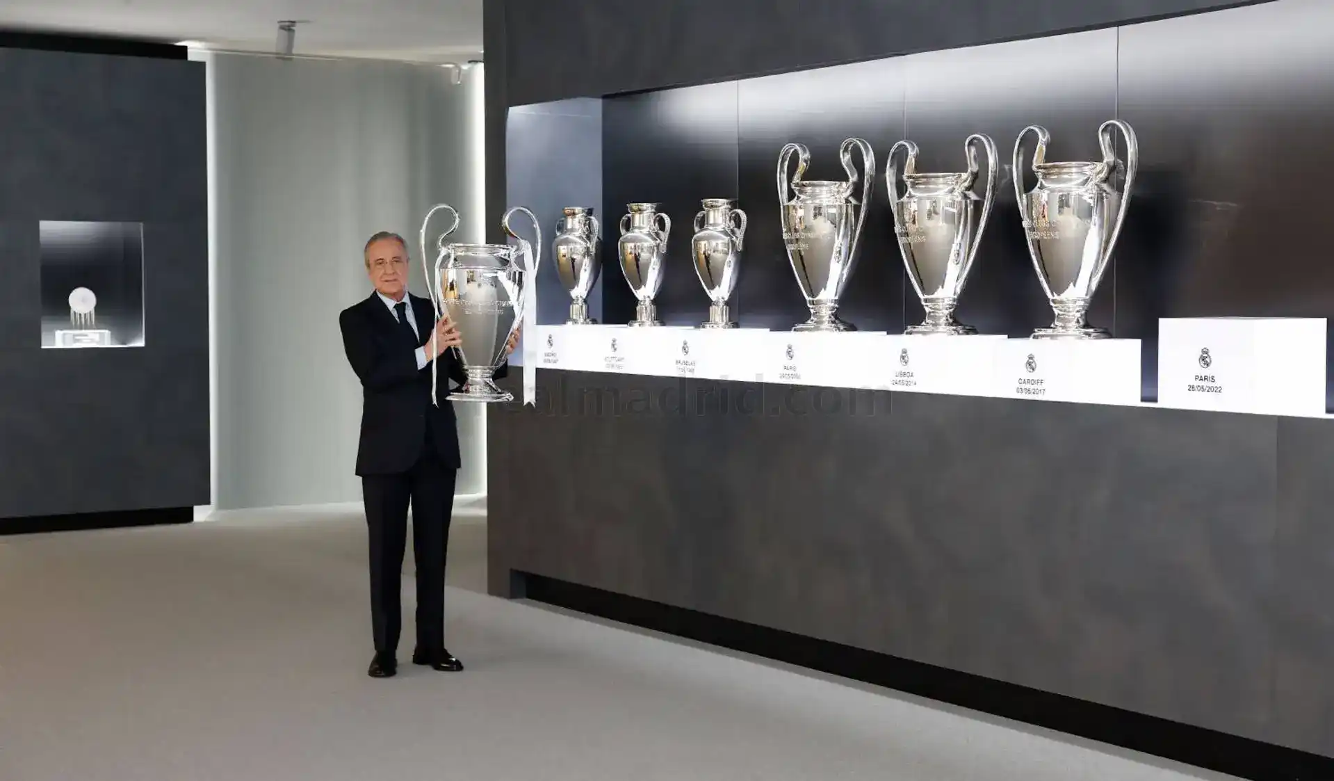 Real Madrid president Florentino Perez holding the Champions League trophy