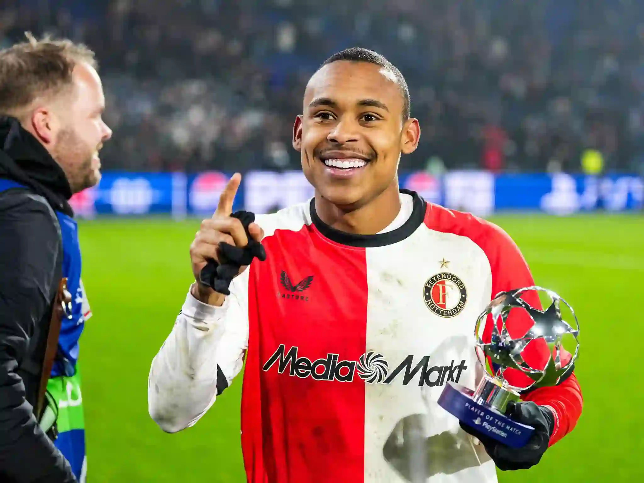 Igor Paixao posing with a Man of the Match award