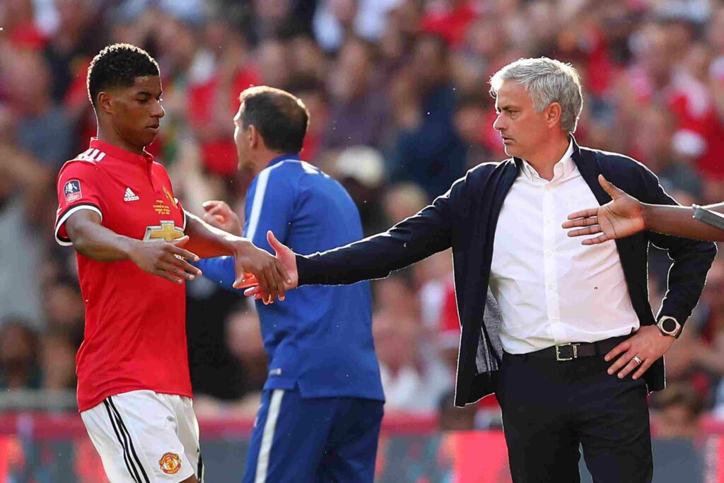 Marcus Rashford and Jose Mourinho clapping hands during their time in Manchester
