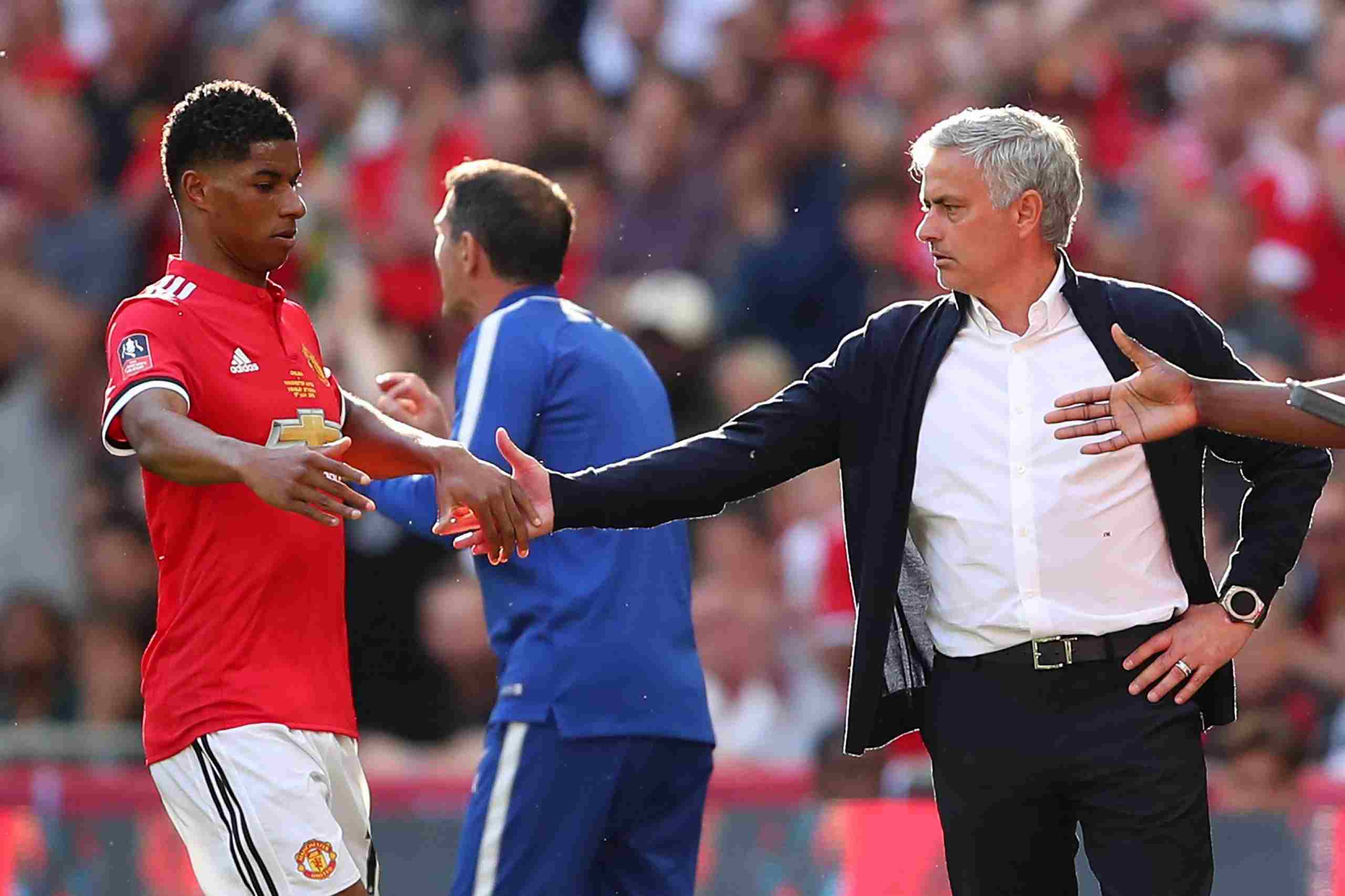 Marcus Rashford and Jose Mourinho clapping hands during their time in Manchester