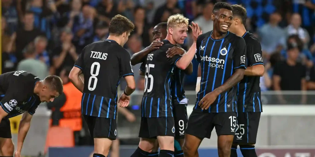Club Brugge players celebrate after scoring against Rangers