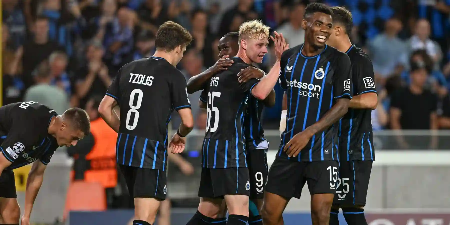 Club Brugge players celebrate after scoring against Rangers