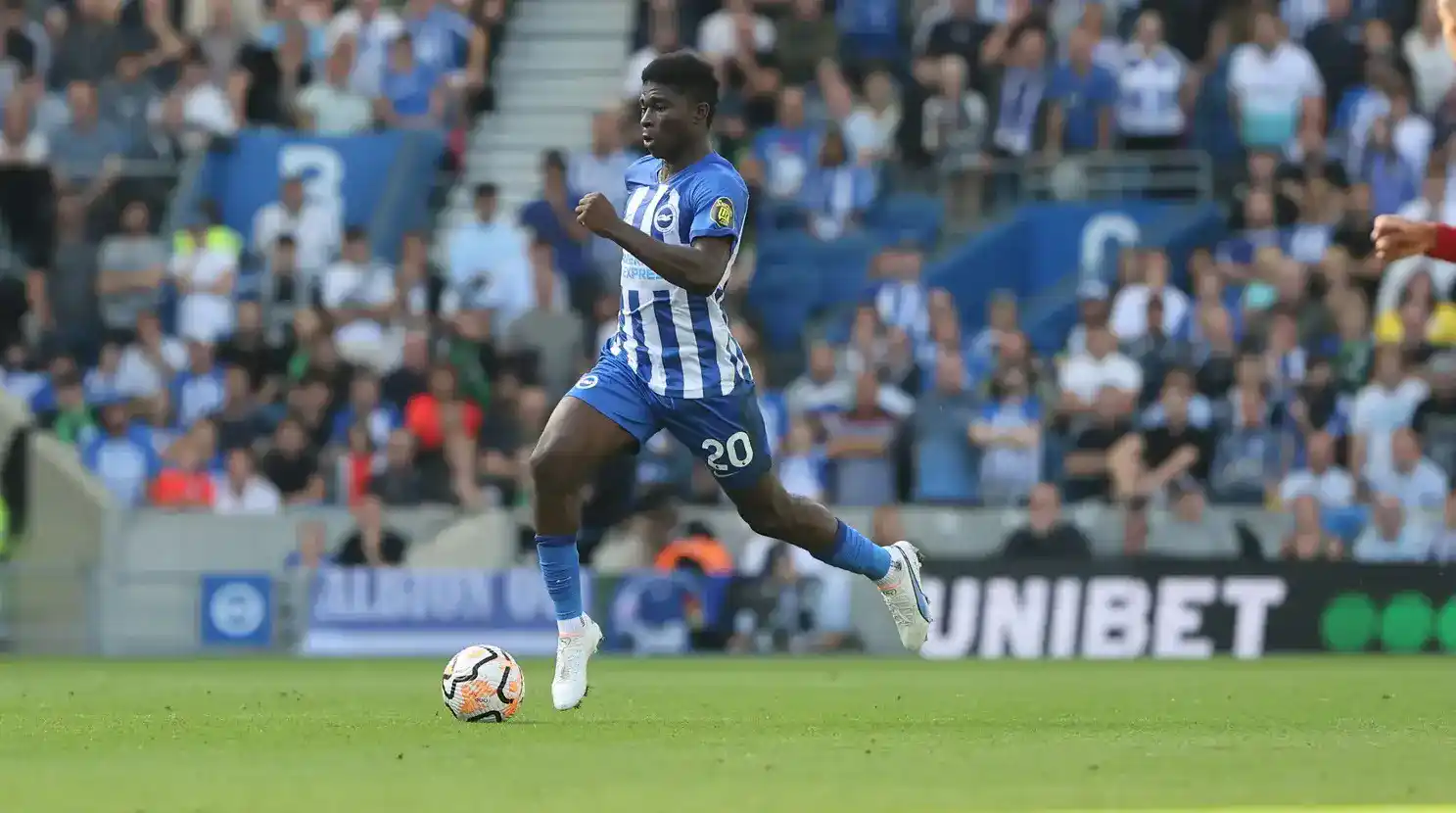 Brighton midfielder Carlos Baleba running with the ball