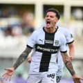 Dennis Man celebrates after scoring for Parma