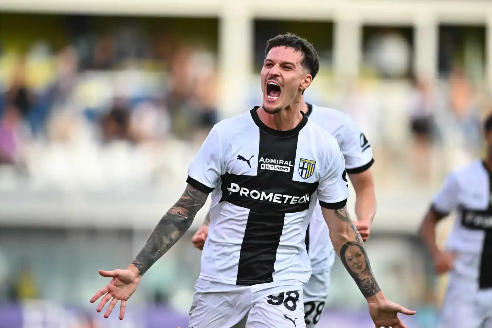 Dennis Man celebrates after scoring for Parma