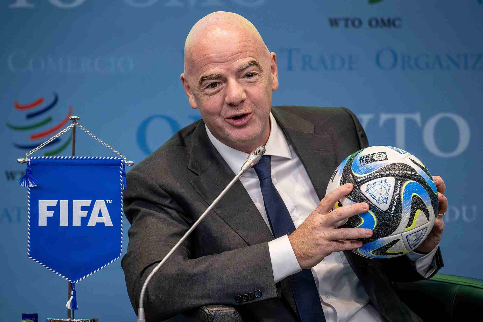 FIFA president Gianni Infantino holding a ball