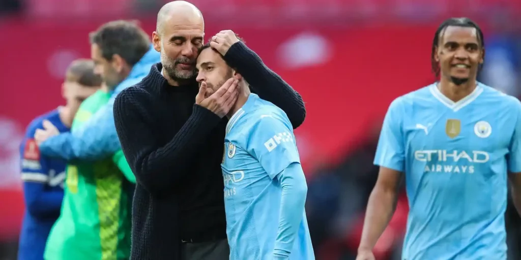 Pep Guardiola giving Bernardo Silva a hug