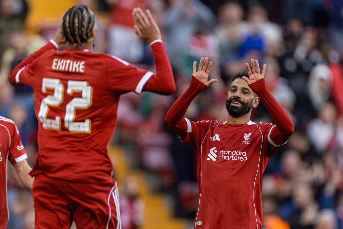 Mohamed Salah and Hugo Ekitike high-fiving