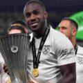 Michail Antonio posing with the Europa Conference League won by West Ham in 2023