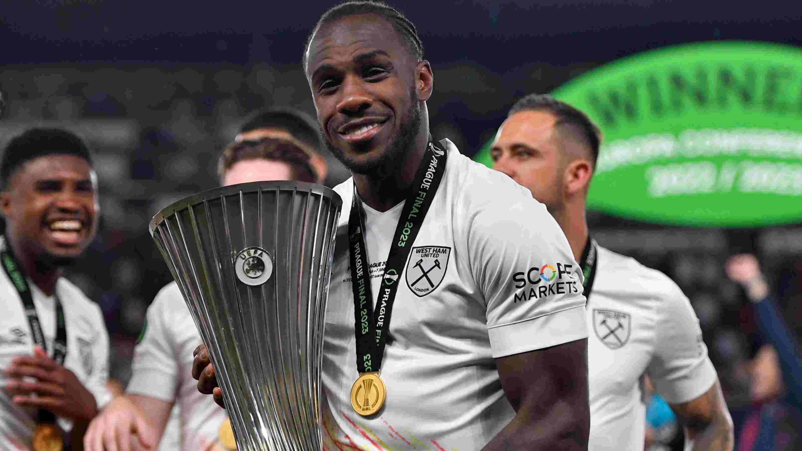 Michail Antonio posing with the Europa Conference League won by West Ham in 2023