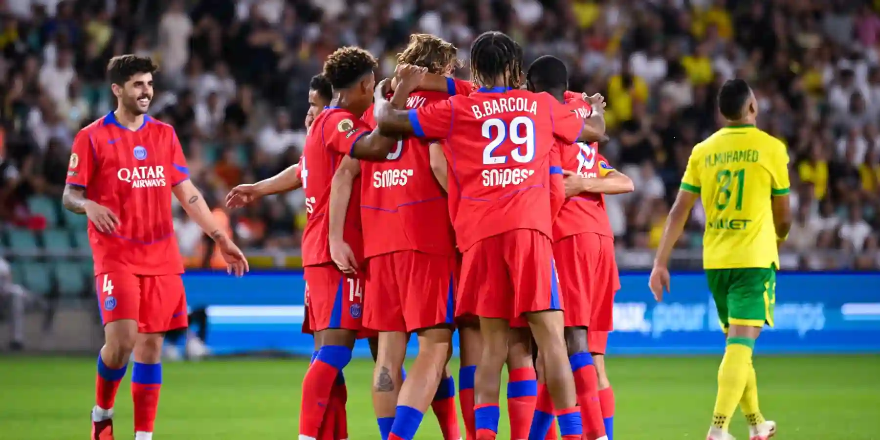 PSG players gathered around Vitinha after he scored against Nantes