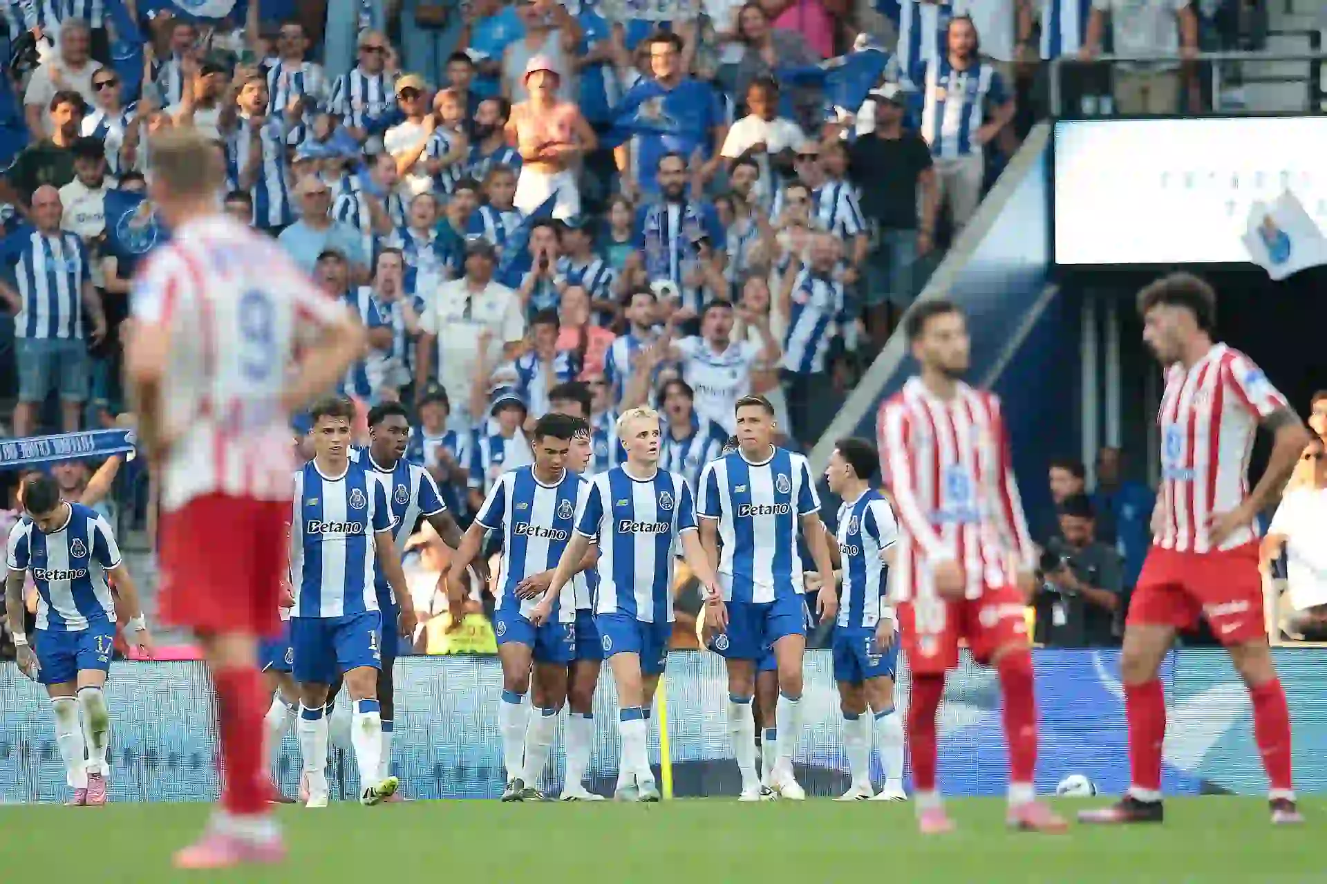 Porto players together after celebrating scoring a goal in friendly against Atletico Madrid