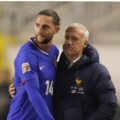Didier Deschamps giving Adrien Rabiot a hug