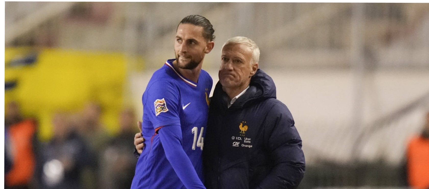 Didier Deschamps giving Adrien Rabiot a hug