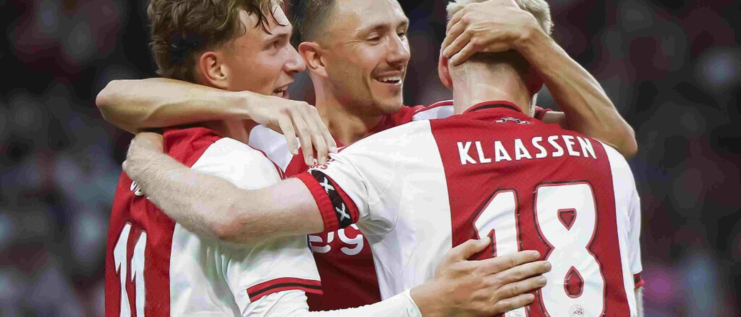 Ajax players celebrate after scoring a goal