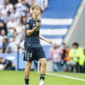 Real Madrid defender Dean Huijsen walks off the field after receiving red card