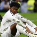 Real Madrid striker Endrick sitting on the pitch