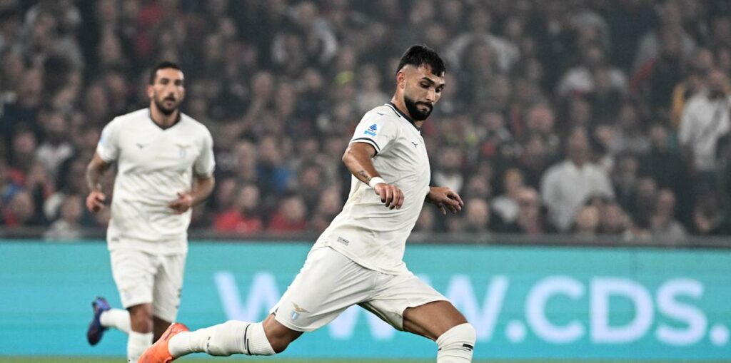 Lazio player shoots towards Genoa goal