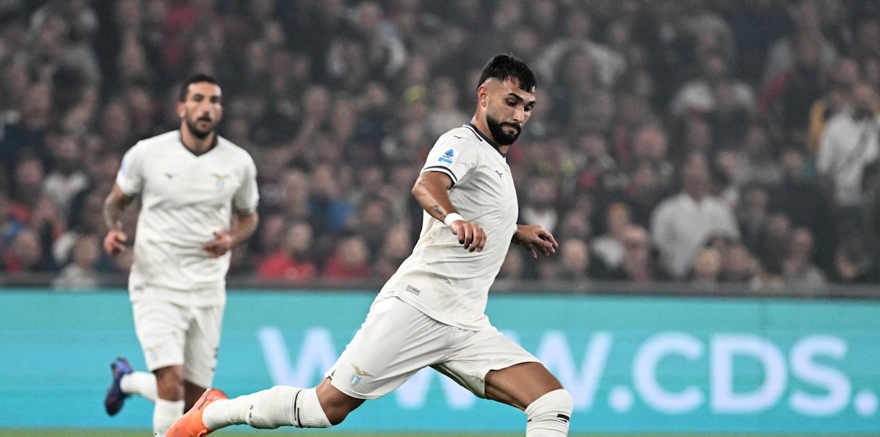 Lazio player shoots towards Genoa goal
