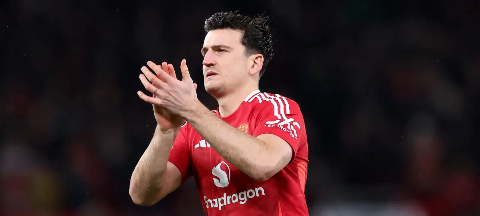 Manchester United defender Harry Maguire clapping