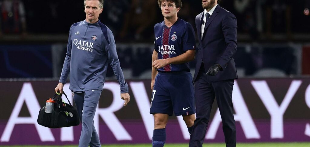 PSG midfielder Joao Neves walks off the field with an injury
