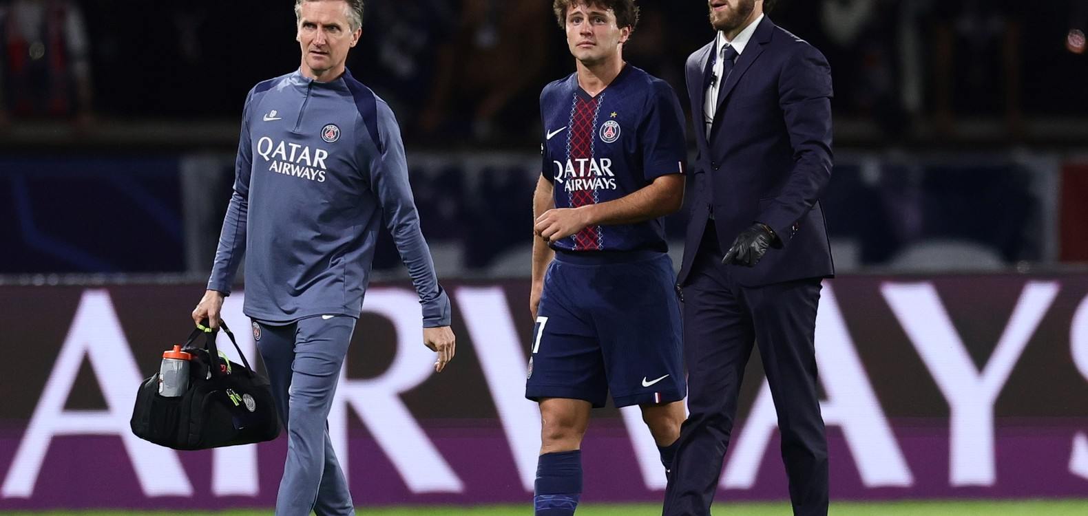 PSG midfielder Joao Neves walks off the field with an injury