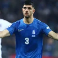 Konstantinos Koulierakis with the Greece national team shirt