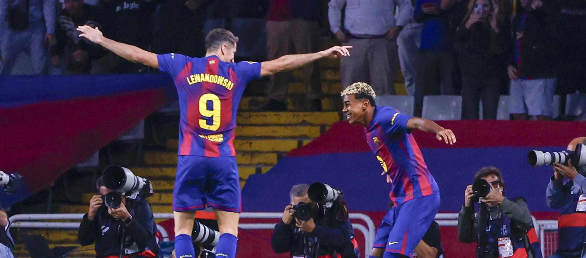 Robert Lewandowski and Lamine Yamal celebrate Barcelona goal