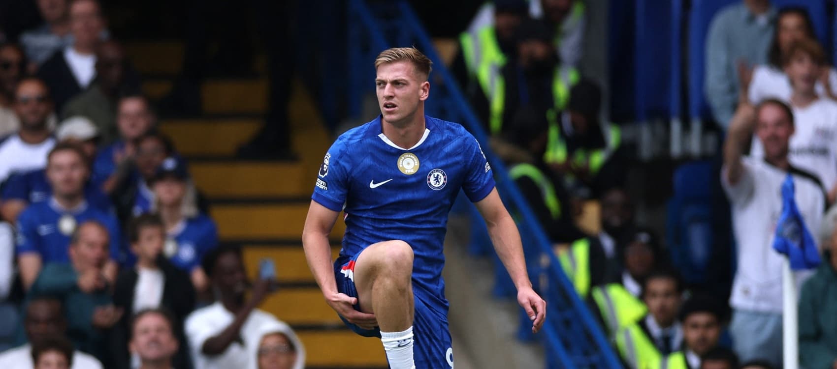 Chelsea striker Liam Delap holding his right leg