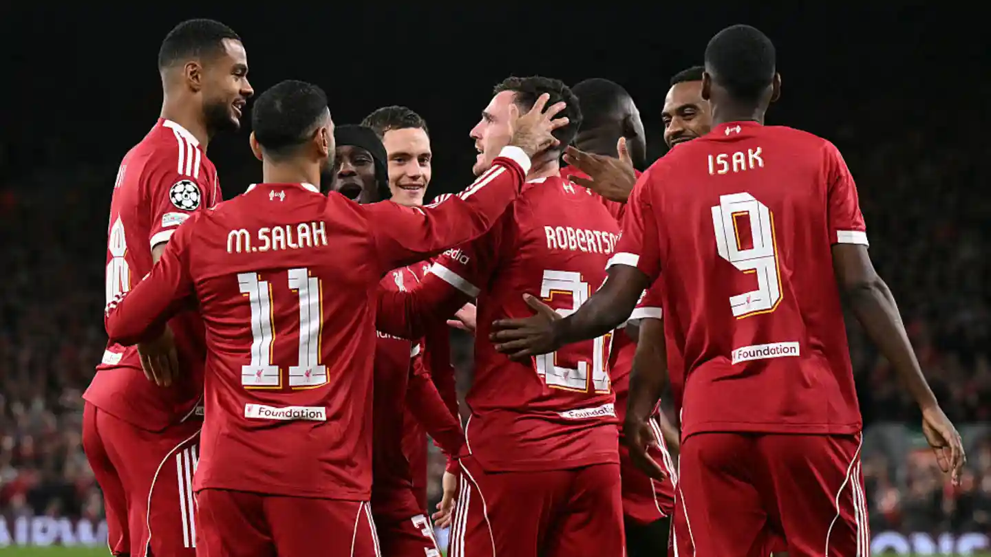 Liverpool players congratulate Andy Robertson after his goal against Atletico Madrid