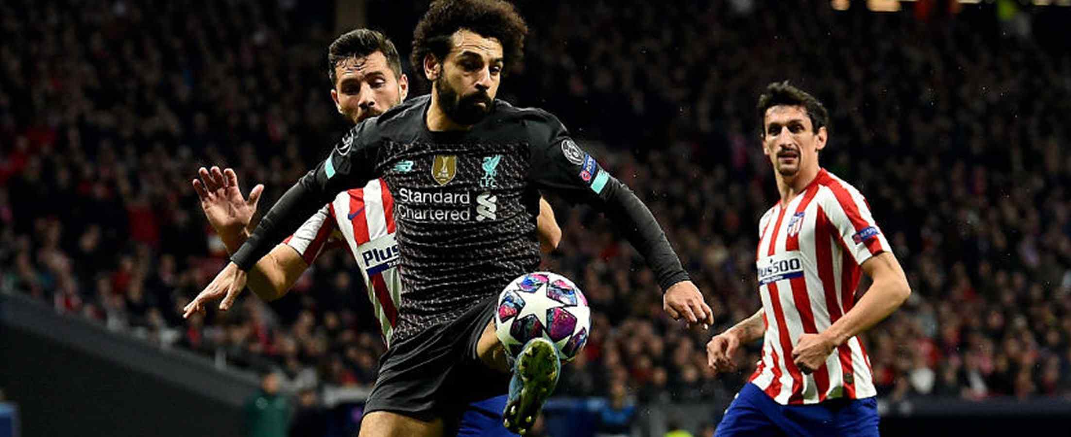Mohamed Salah under pressure by Atletico Madrid players