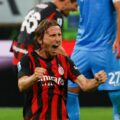 Luka Modric celebrates Milan's win over Napoli