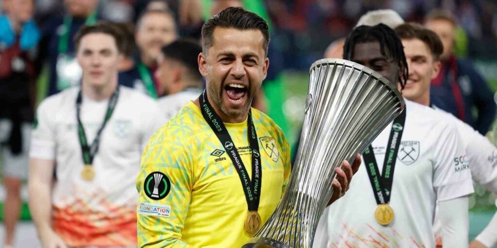 Lukasz Fabianski holding the Europa Conference League trophy