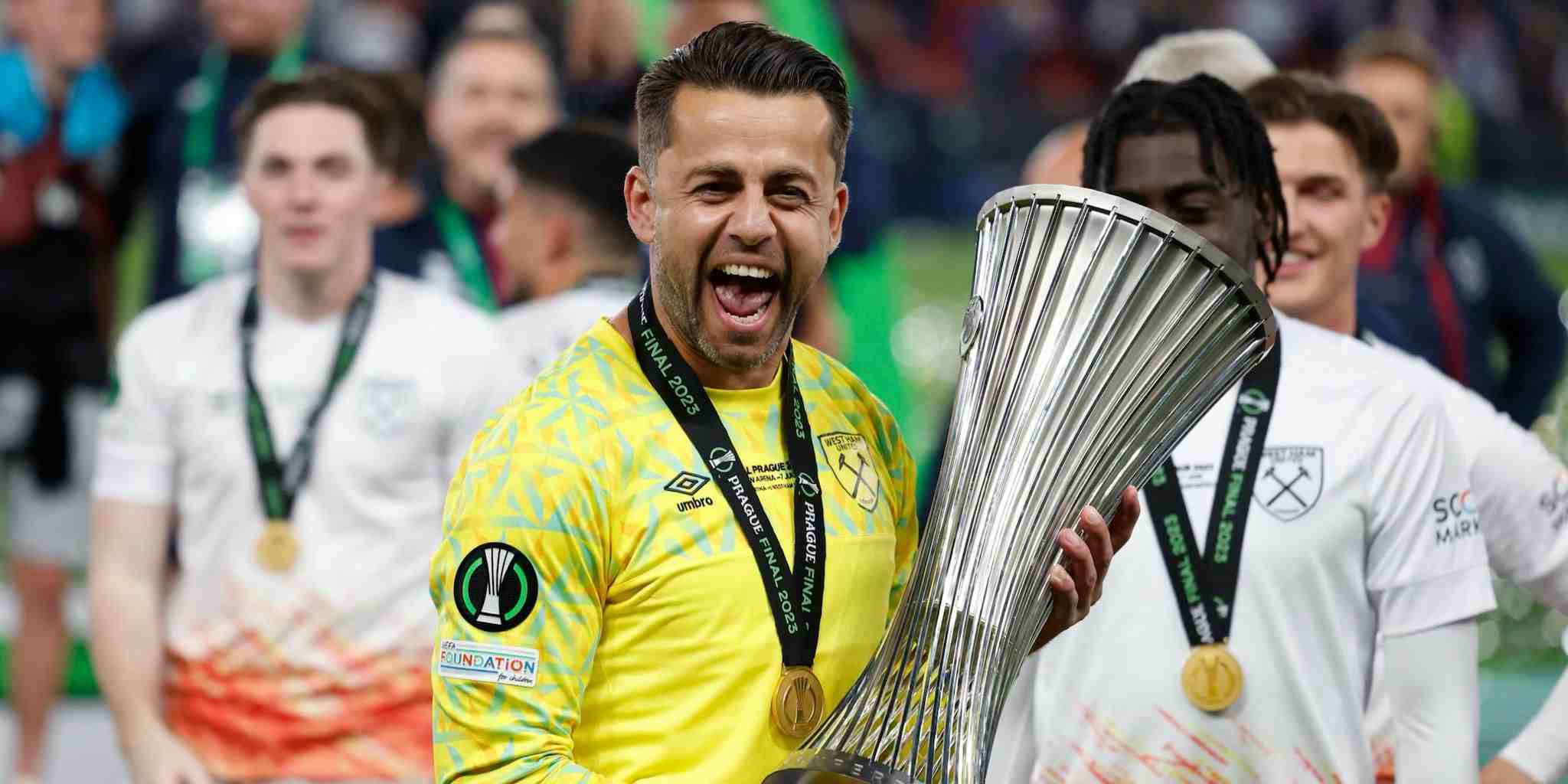 Lukasz Fabianski holding the Europa Conference League trophy