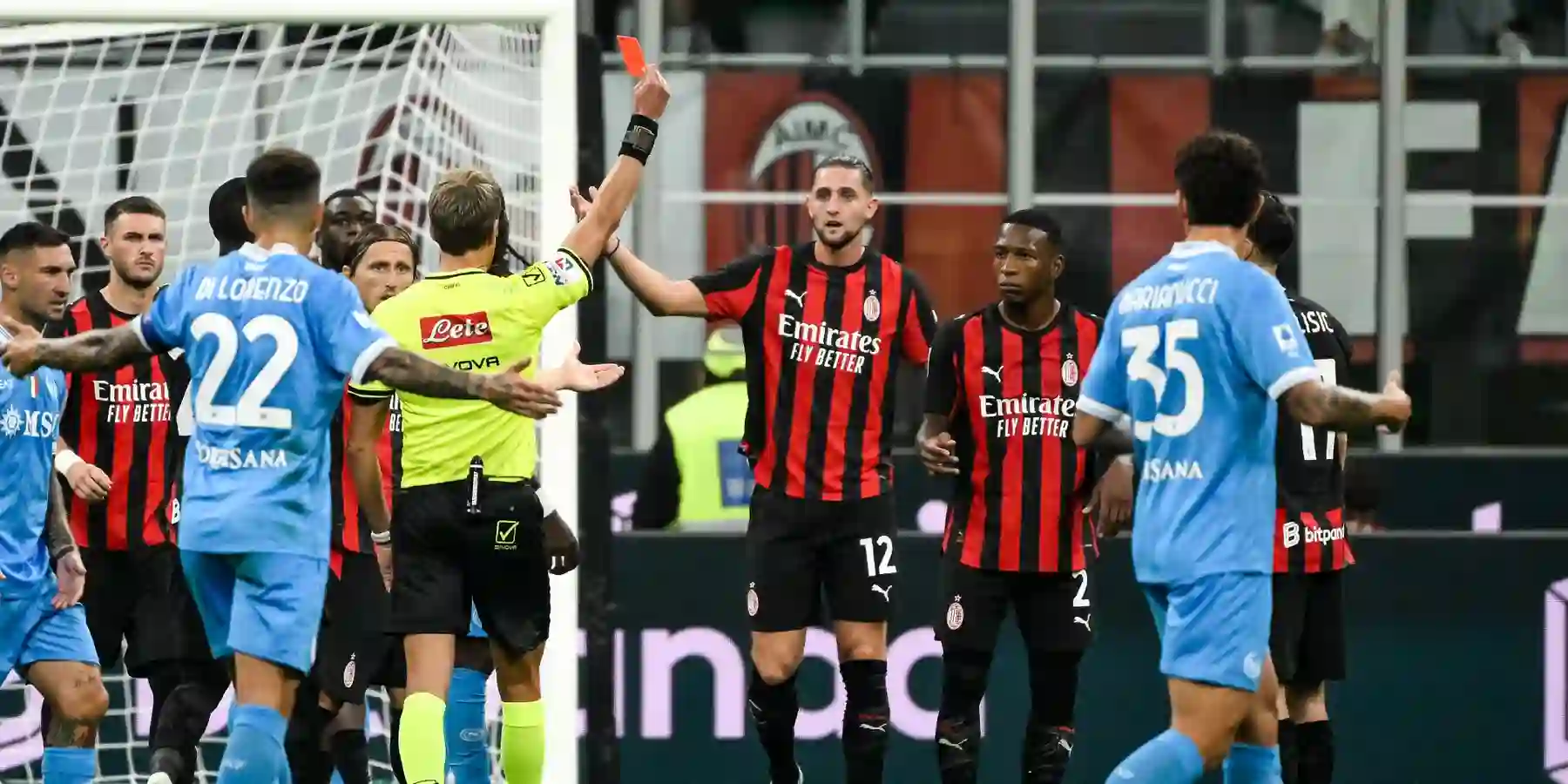 Referee showing Milan player a red card