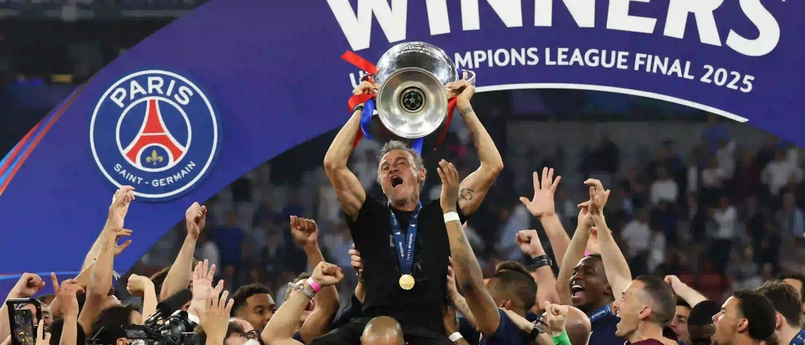 PSG head coach Luis Enrique lifting the Champions League trophy