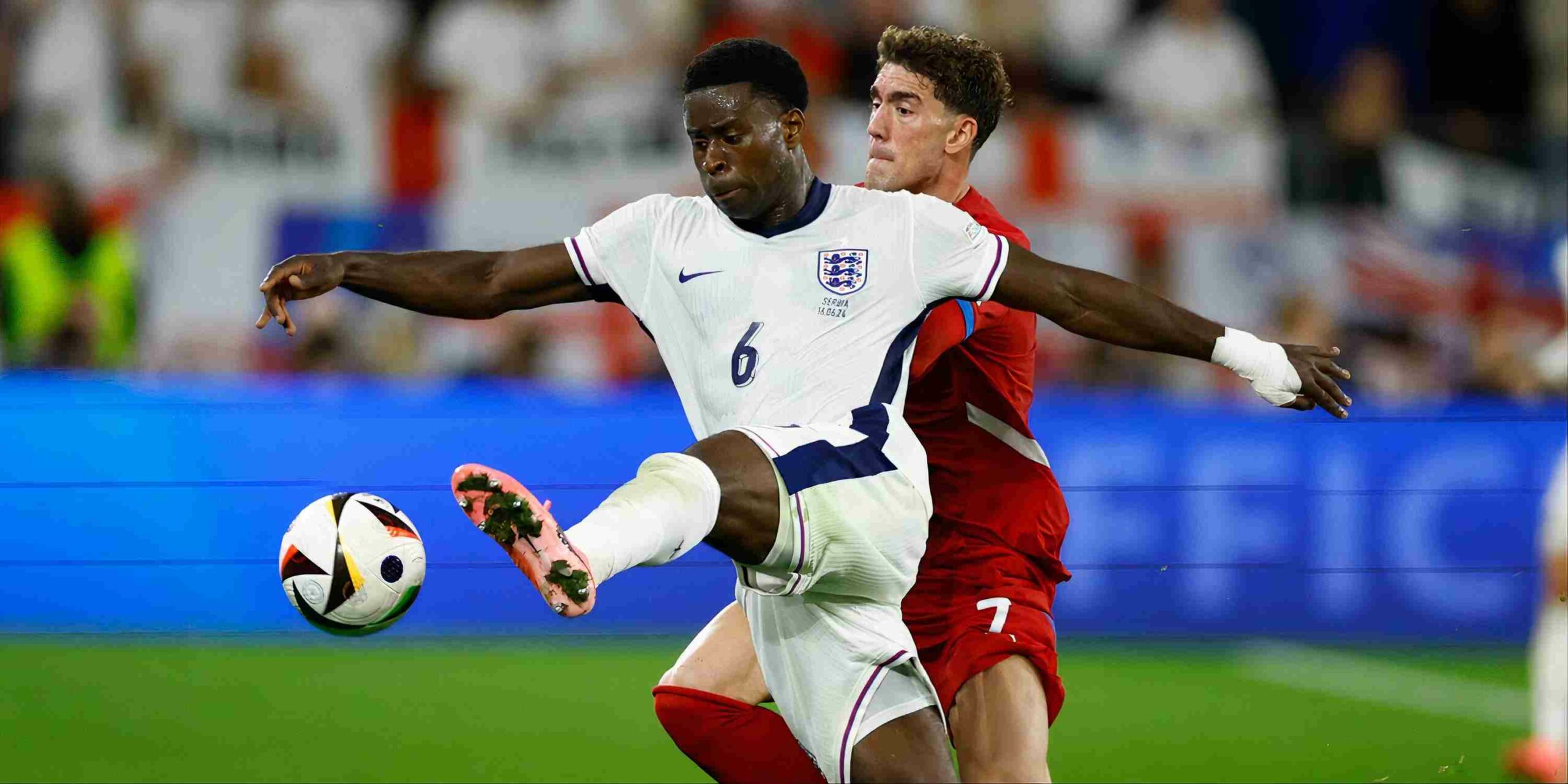 Marc Guehi and Dusan Vlahovic in a duel during Serbia-England World Cup Qualifier