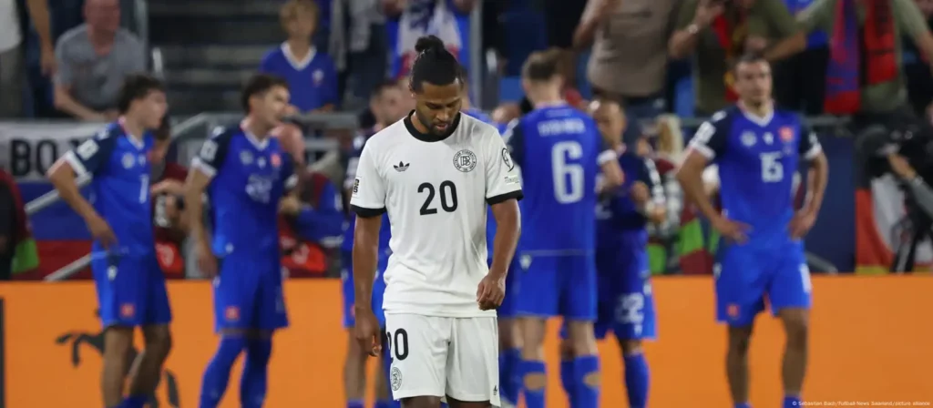 Slovakian players celebrate in the background after scoring against Germany