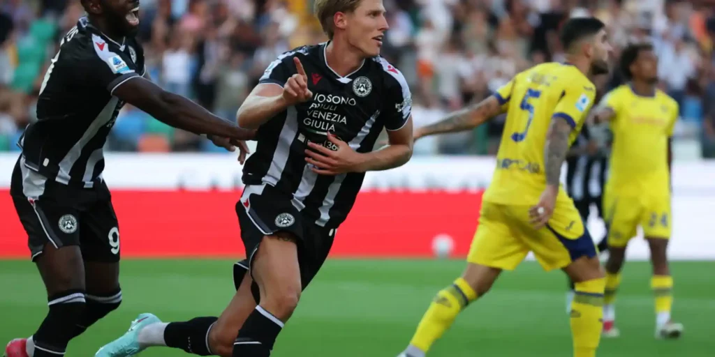 Udinese defender Thomas Kristensen celebrates after scoring against Verona