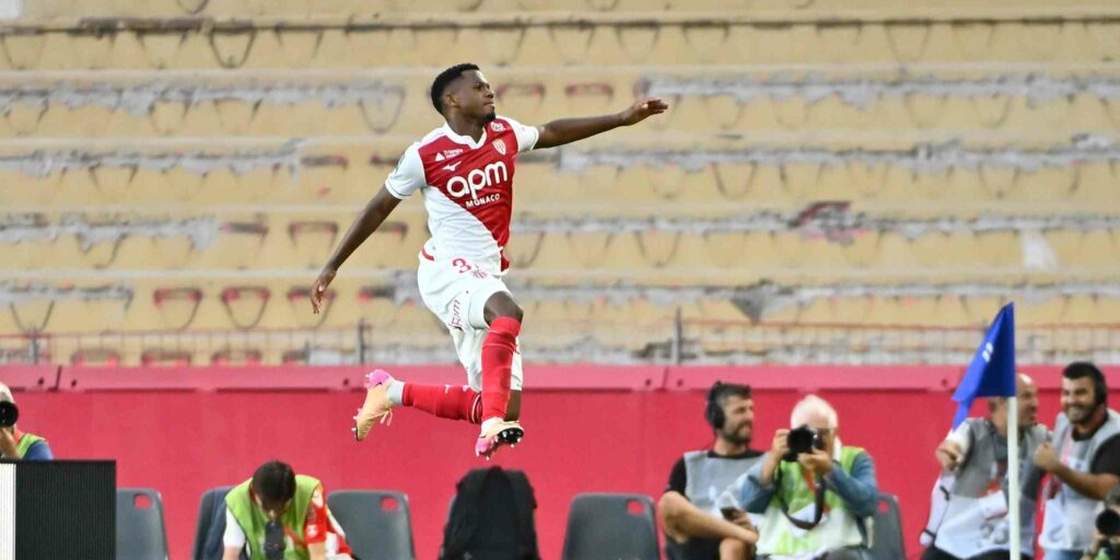 Ansu Fati jumping in the air after scoring for Monaco