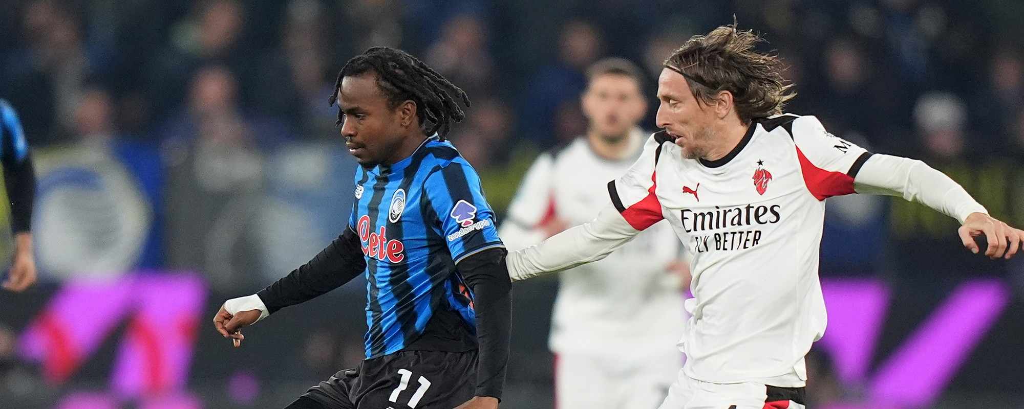 Ademola Lookman and Luka Modric in a battle for the ball