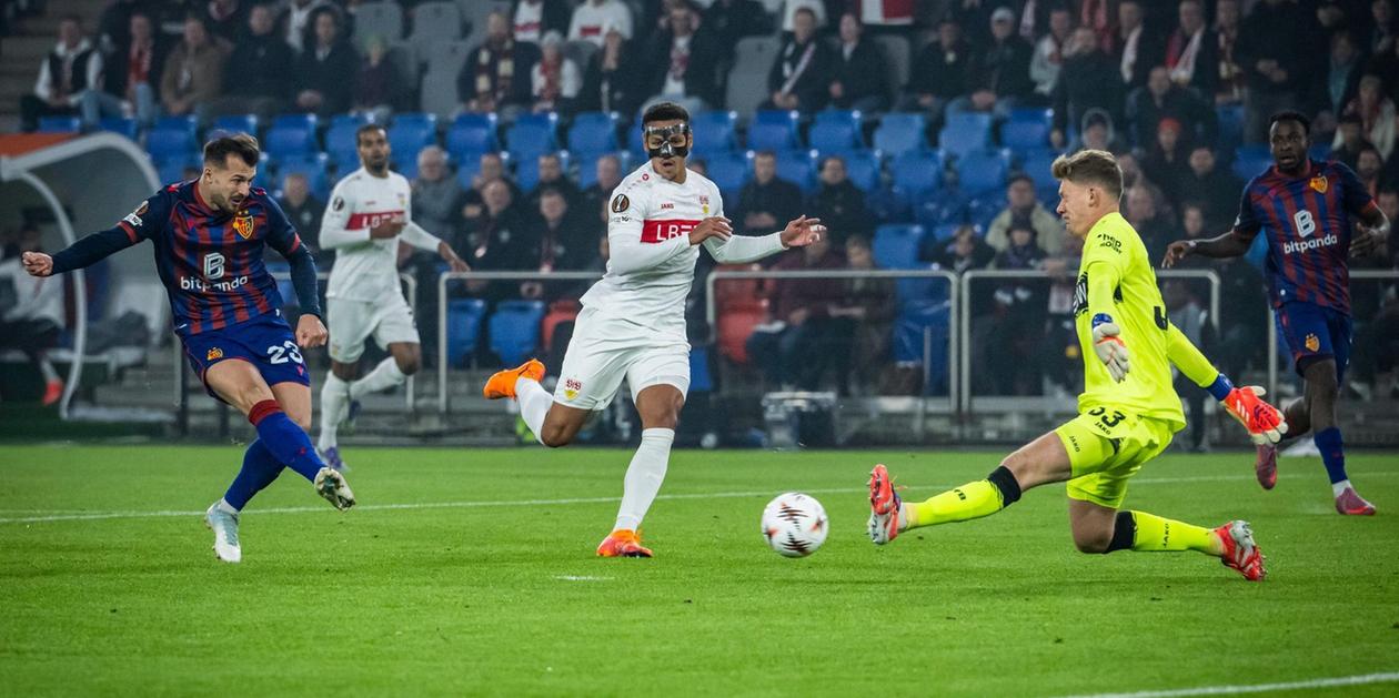 Basel player shoots towards Stuttgart goal