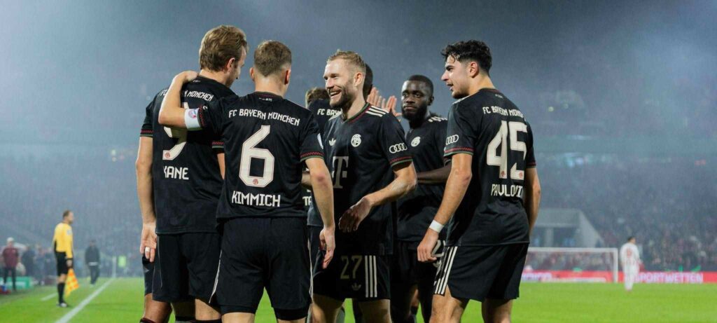 Bayern Munich players celebrate after scoring against Koln in DFB Pokal