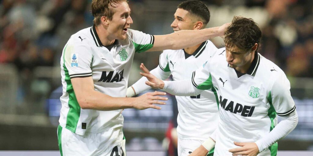 Sassuolo players celebrate after just scoring against Cagliari