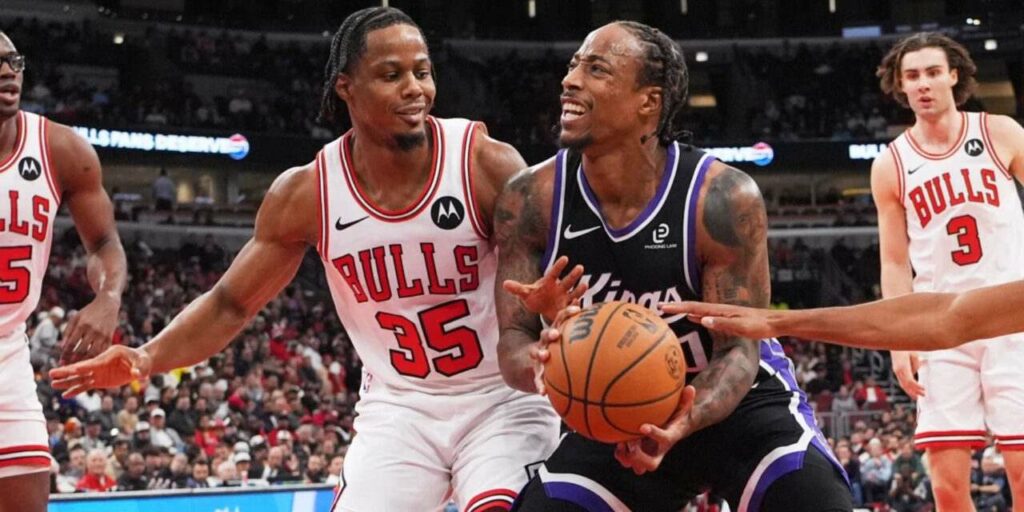 DeMar DeRozan protects the ball from Chicago Bulls players