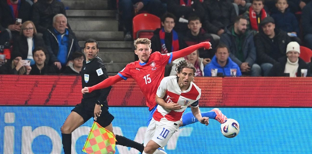 Luka Modric and a Czech player battle for the ball