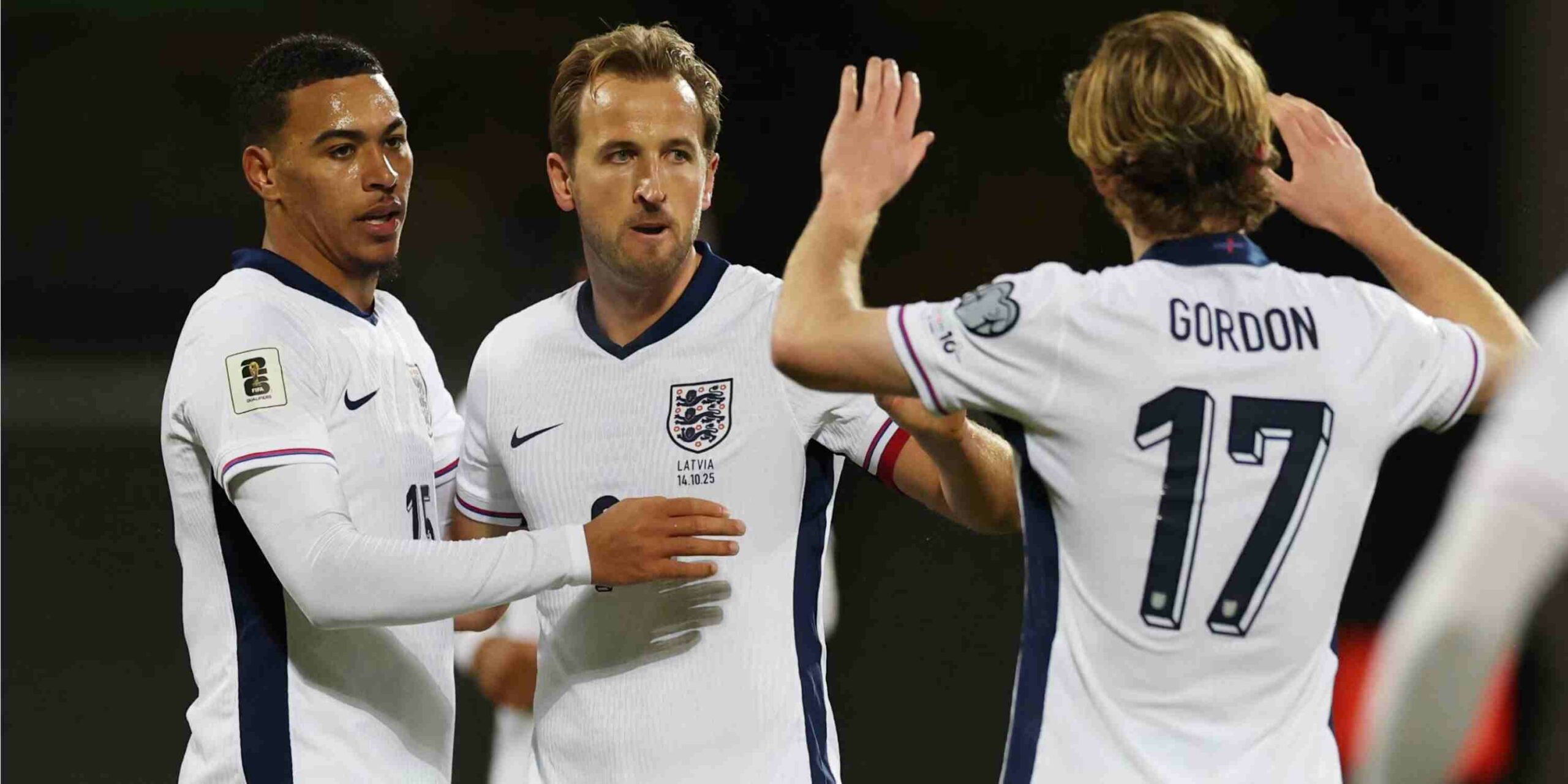 England players congratulate one another after scoring against Latvia