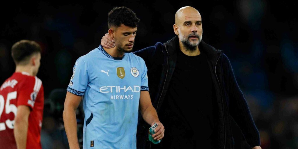 Pep Guardiola and Matheus Nunes