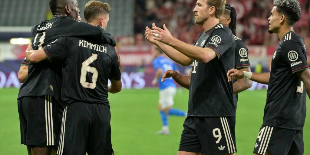 Bayern Munich players rushing to congratulate Nico Jackson for his first goal