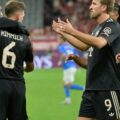 Bayern Munich players rushing to congratulate Nico Jackson for his first goal